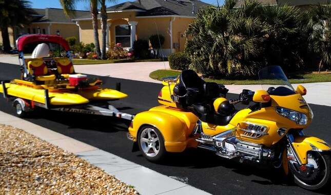 Motorcycle towing a CraigCat